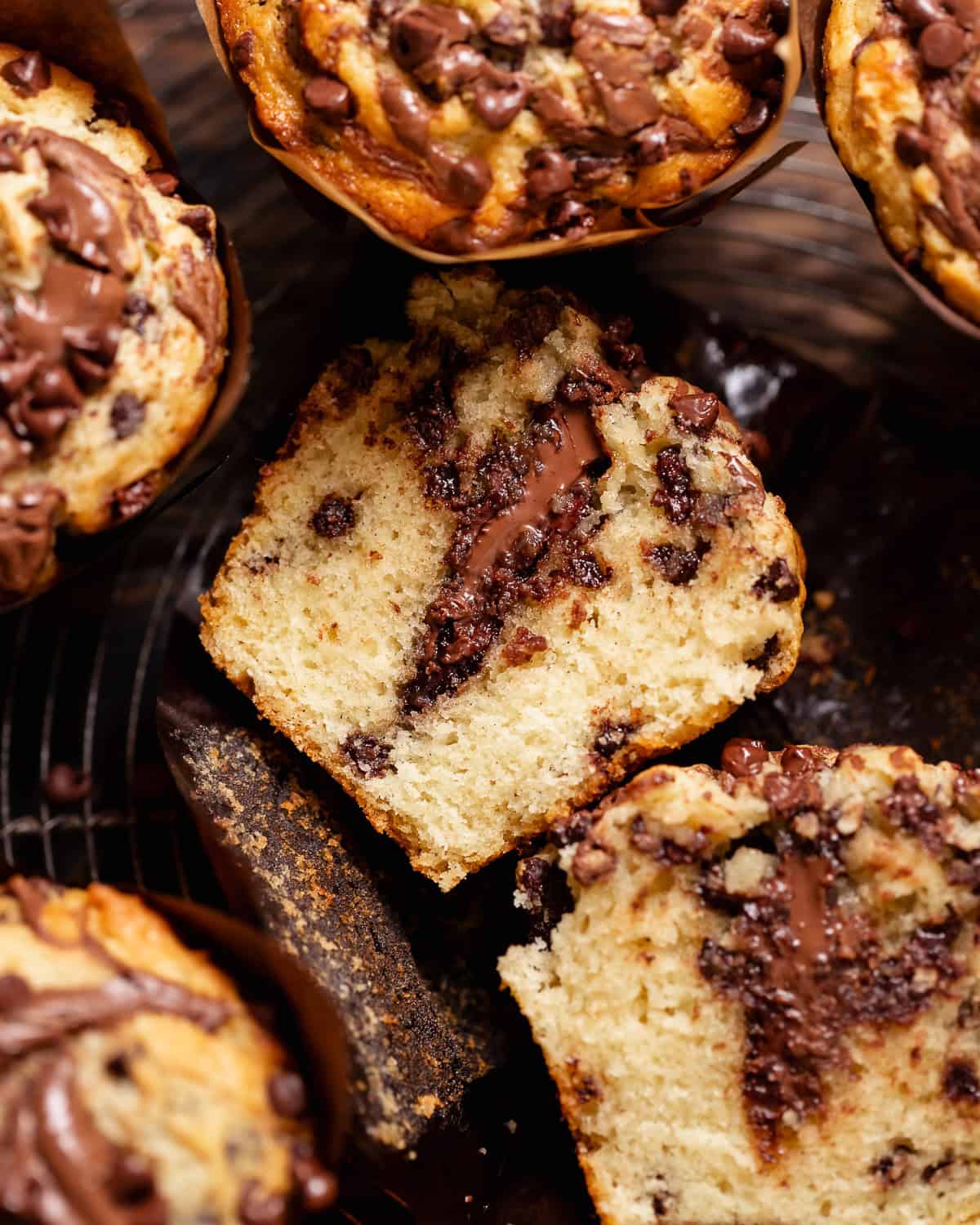 Chocolate Nutella muffin cut in half to reveal the melted Nutella center and soft crumb.