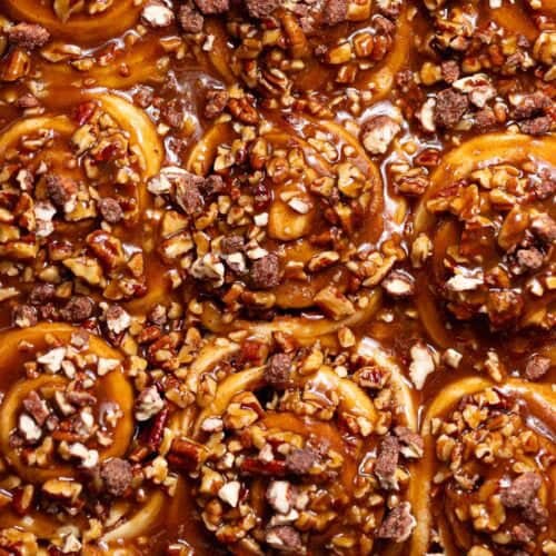 Butter pecan sticky buns covered in thick caramel pecan sauce.