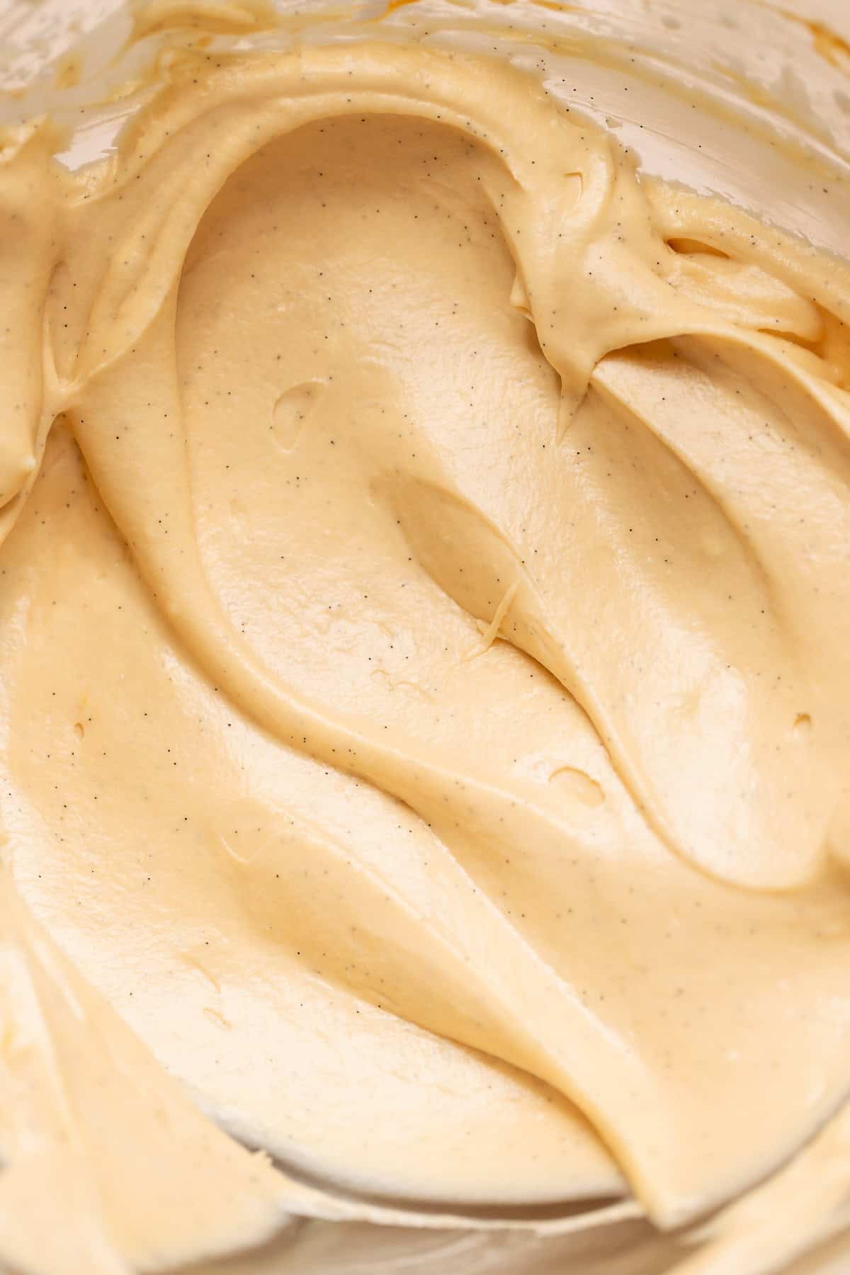 Vanilla bean caramel cream cheese frosting in a mixing bowl.